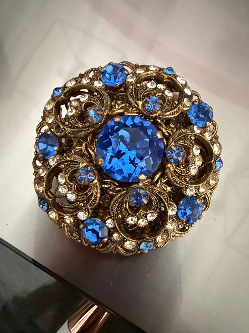 Vintage-Style Gold Filigree Brooch with Blue Crystals